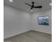 Simple bedroom with vinyl plank flooring and a window at 10869 N 81St Ave, Peoria, AZ 85345