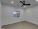 Bright bedroom with large window and vinyl plank flooring at 10869 N 81St Ave, Peoria, AZ 85345