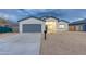 New construction home with gray garage and neutral colors at 10869 N 81St Ave, Peoria, AZ 85345