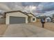 Modern home with gray garage door and neutral exterior at 10869 N 81St Ave, Peoria, AZ 85345