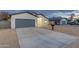 Modern home with gray garage door and neutral exterior at 10869 N 81St Ave, Peoria, AZ 85345