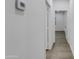 Clean hallway with vinyl plank flooring and neutral walls at 10869 N 81St Ave, Peoria, AZ 85345