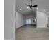 Open living area with gray flooring and access to backyard at 10869 N 81St Ave, Peoria, AZ 85345