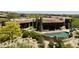 Scenic aerial capture of home featuring an elegant pool, lush landscaping, and sophisticated outdoor architecture at 11105 E Tamarisk Way, Scottsdale, AZ 85262