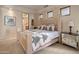 Spacious bedroom with a large bed and mirrored nightstand at 11105 E Tamarisk Way, Scottsdale, AZ 85262