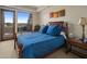 Bright bedroom with a double bed and access to a private balcony at 11105 E Tamarisk Way, Scottsdale, AZ 85262