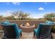 Peaceful firepit area with comfortable seating and scenic views at 11105 E Tamarisk Way, Scottsdale, AZ 85262