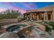 Relax in the outdoor hot tub with mountain views at 11105 E Tamarisk Way, Scottsdale, AZ 85262