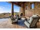 Relaxing patio with fireplace and mountain views at 11105 E Tamarisk Way, Scottsdale, AZ 85262