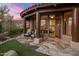 Stone patio with seating area, offering stunning sunset views at 11105 E Tamarisk Way, Scottsdale, AZ 85262