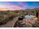 Inviting pool and spa with fire pit and mountain views at 11105 E Tamarisk Way, Scottsdale, AZ 85262