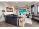 Recreation room with leather sofa and built-in entertainment center at 11105 E Tamarisk Way, Scottsdale, AZ 85262