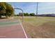 Outdoor basketball court with green and red surface at 11534 W Longley Ln, Youngtown, AZ 85363