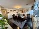 Formal dining room with dark wood table and six chairs at 11534 W Longley Ln, Youngtown, AZ 85363