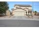 Two-story house with solar panels and a two-car garage at 11534 W Longley Ln, Youngtown, AZ 85363