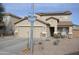 Two-story house with solar panels and desert landscaping at 11534 W Longley Ln, Youngtown, AZ 85363