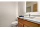 Clean bathroom featuring a vanity with a quartz countertop and a toilet at 11686 N Spotted Horse Way, Fountain Hills, AZ 85268