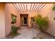 Covered entryway with a pergola and desert landscaping at 11686 N Spotted Horse Way, Fountain Hills, AZ 85268