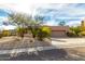 House exterior with a two-car garage and mature desert landscaping at 11686 N Spotted Horse Way, Fountain Hills, AZ 85268