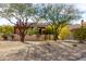 Tan stucco house with a two-car garage and gravel landscaping at 11686 N Spotted Horse Way, Fountain Hills, AZ 85268