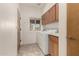 Convenient laundry room with washer, dryer, and cabinets at 11686 N Spotted Horse Way, Fountain Hills, AZ 85268