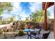 Desert landscape with patio furniture and mountain views at 11686 N Spotted Horse Way, Fountain Hills, AZ 85268