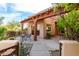 Covered patio with seating area and desert landscaping at 11686 N Spotted Horse Way, Fountain Hills, AZ 85268