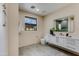 Modern bathroom with white vanity and gray tile floor at 12201 N 65Th St, Scottsdale, AZ 85254