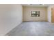 Spacious bedroom with gray tile floors and large window at 12201 N 65Th St, Scottsdale, AZ 85254