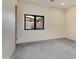 Spacious bedroom with gray tile floors and large window at 12201 N 65Th St, Scottsdale, AZ 85254