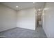 Bright bedroom with gray tile floors and access to closet at 12201 N 65Th St, Scottsdale, AZ 85254