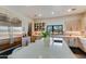 Modern kitchen with light wood cabinets and a large island at 12201 N 65Th St, Scottsdale, AZ 85254