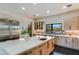 Modern kitchen features stainless steel appliances and an island with white countertop at 12201 N 65Th St, Scottsdale, AZ 85254