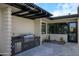 Modern outdoor kitchen with built-in grill and ample counter space at 12201 N 65Th St, Scottsdale, AZ 85254