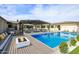 Inviting pool with a fire pit and patio furniture under a pergola at 12201 N 65Th St, Scottsdale, AZ 85254