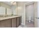 Bathroom with granite countertop, double sinks and shower at 15207 S 183Rd Ave, Goodyear, AZ 85338