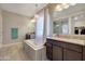 Elegant bathroom featuring a soaking tub and double vanity at 15207 S 183Rd Ave, Goodyear, AZ 85338