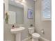 Clean and modern powder room with pedestal sink at 15207 S 183Rd Ave, Goodyear, AZ 85338