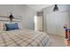 Spacious bedroom with double doors and a cozy bed at 15207 S 183Rd Ave, Goodyear, AZ 85338