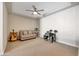 Cozy bonus room with a couch, guitar, and electronic drum set at 15207 S 183Rd Ave, Goodyear, AZ 85338