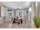 Dining room with wooden table, bench, and white plantation shutters at 15207 S 183Rd Ave, Goodyear, AZ 85338