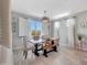 Charming dining room with wooden table and white plantation shutters at 15207 S 183Rd Ave, Goodyear, AZ 85338