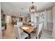 Bright dining room features a wooden table and seating for six at 15207 S 183Rd Ave, Goodyear, AZ 85338