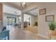 Open concept entryway leading to living room and kitchen with pool view at 15207 S 183Rd Ave, Goodyear, AZ 85338