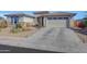 Beautiful one-story home with a two-car garage and drought-tolerant landscaping at 15207 S 183Rd Ave, Goodyear, AZ 85338