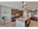 Spacious kitchen with island, stainless steel appliances, and granite countertops at 15207 S 183Rd Ave, Goodyear, AZ 85338