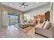 Spacious living room with sliding doors leading to the pool area at 15207 S 183Rd Ave, Goodyear, AZ 85338