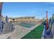 Expansive pool and patio area with artificial turf and grill at 15207 S 183Rd Ave, Goodyear, AZ 85338