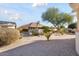 Landscaped backyard with gravel and desert plants at 15820 W Falcon Ridge Dr, Sun City West, AZ 85375