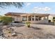 Backyard view showing a house with a covered patio at 15820 W Falcon Ridge Dr, Sun City West, AZ 85375